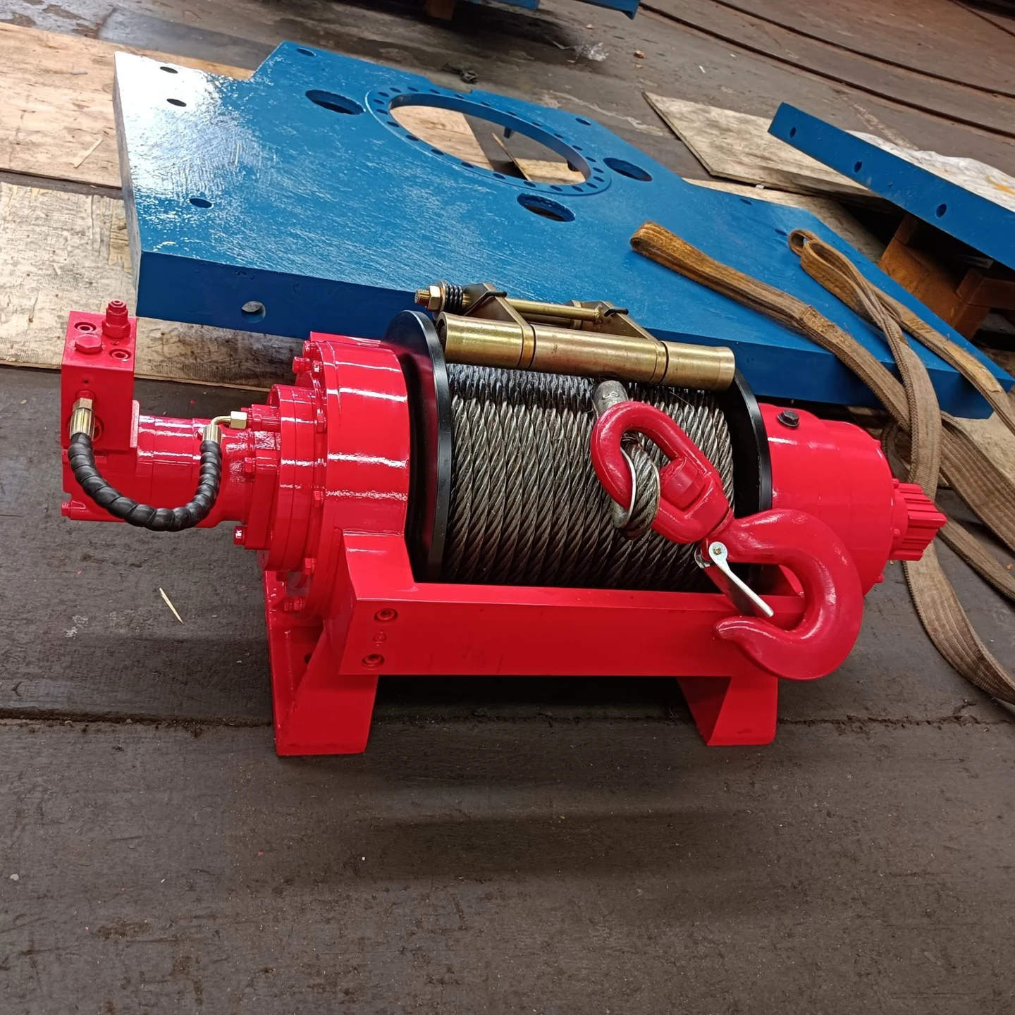 Red Chuangdong hydraulic winch with steel wire rope, photographed at the factory